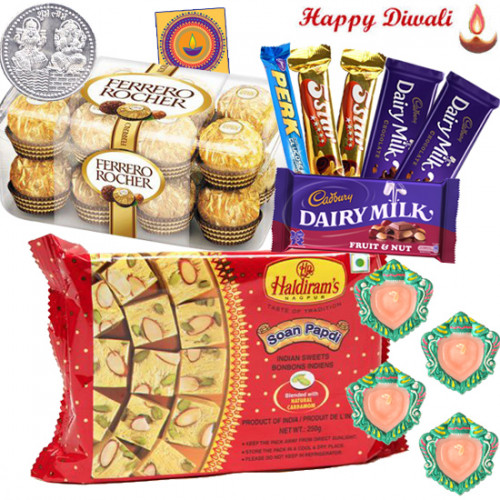 Assorted Hamper - Haldiram Soan Papdi 250 gms, Ferrero Rocher 16 pcs, Cadbury Hamper with 4 Diyas and Laxmi-Ganesha Coin