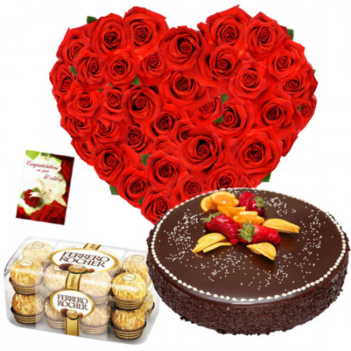 Pure Affection - 50 Red Roses in Heart Shaped Arrangement, 1/2 kg Chocolate Cake, Ferrero Rocher 16 pcs + Card