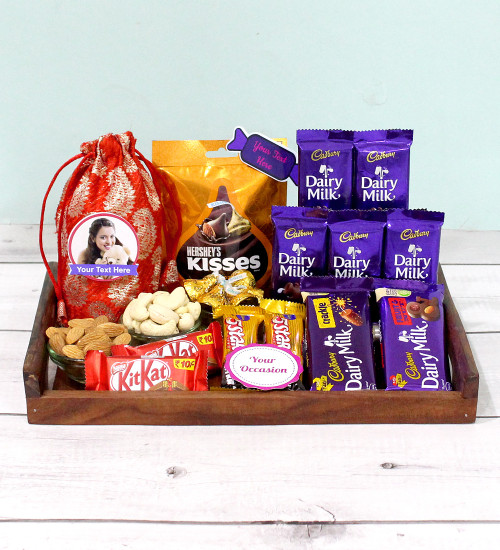 Gladness in Tray - Almond & Cashew in Potli (D), Hersheys Kisses Almond, Dairy Milk Fruit n Nut, Dairy Milk Crackle, 5 Dairy Milk, 2 Five Star, 2 Kit Kat, 3 Personalized Props, Wooden Tray and Card