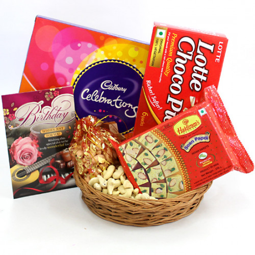 Relishing Hamper - Cashewnuts in Potli, Cadbury Celebrations, Soan Papdi 250 gms, Chocopie, Basket and Card
