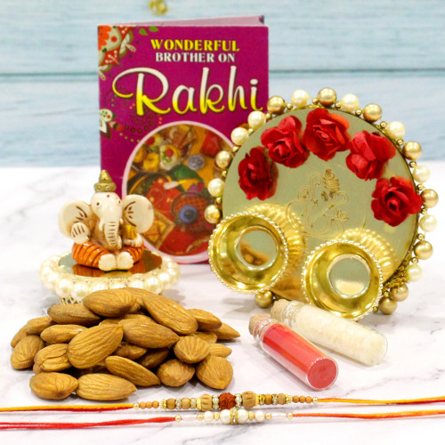 Crafted Ganesh - Almonds 100 gms, Ganesh Idol, Elegant Ganesh Thali with Flowers & Pearls with 2 Rakhi and Roli-Chawal
