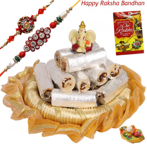 Sweet Delight Thali - Kaju Anjir Roll, Decorative Thali (G), Ganesh Idol with 2 Rakhi and Roli-Chawal