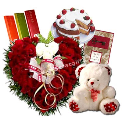 Heartfelt Celebration - 50 Red Roses + 1/2 Kg Cake + Temptations 3 Bars + Teddy 8" + Card