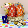 Dryfruit Bliss - Almond in Potli (D), Cashew in Potli (D), Pista in Potli (D), Raisin in Potli (D), Basket, 2 Rakhi, Free Greeting Card & Roli-Chawal