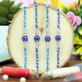 Set of 4 Rakhis - Elegant Defender Rakhi – Blue Nazar Bead with Silver Sparkle