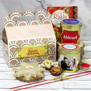 Sweet & Healthy Personalized Rakhi Hamper - Almonds in Personalized Tin, Cashews Personalized in Tin, Kaju Katli, Charming Cream & Golden Gift Box with 2 Rakhi & Tika