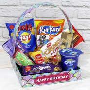Gifted Delights - Cadbury Chocobakes, Britania Cake, Oreo Mini Pack, Nutri Choice Biscuits, Lays, Kurkure, Hide n Seek Biscuit, Tiffany Wafer Biscuit, Ferrero Rocher 4 pcs, 4 Personalized Props, Kraft Paper Basket and Card