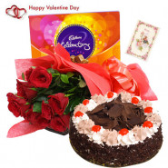 Rosey Chocolaty Delight - 12 Red Roses, 1/2 Kg Black Forest Cake, Cadbury Celebration & Valentine Greeting Card