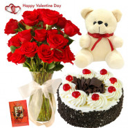 Flowery Treat - 10 Red Roses in Vase, Teddy 6 inch, 1/2 kg Black Forest Cake & Valentine Greeting Card