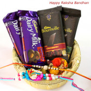 Dark N Nutty - 2 Bournville 30 gms, 2 Cadbury Dairy Milk Fruit & Nut 38 gms in Basket with 2 Rakhi and Roli-Chawal