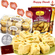 Remarkable Hamper - Haldiram Soan Papdi 1 kg, 2 Haldiram Namkeen, Ferrero Rocher 16 pcs with 4 Diyas and Laxmi-Ganesha Coin