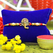 Golden Ganesha Rakhi with Radiant Pearls