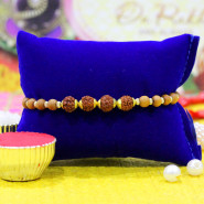 Charming Golden Capped Rudraksha Bracelet Rakhi