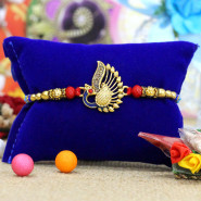 Charming Peacock Motif Rakhi with Diamonds & Pearls