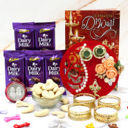 Cashew Thali - Cashew 200 gms, 5 Dairy Milk, Fancy Ganesha Thali with Flowers & Pearls with 4 Golden Diyas and Laxmi-Ganesha Coin