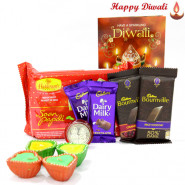 Royal Sweet Combo - Haldiram Soan Papdi 500 gms, 2 Bournville bars, 2 Dairy Milk Bars with 4 Diyas and Laxmi-Ganesha Coin
