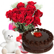 Flame of Joy - 12 Red Roses in a Vase,  1/2 Kg Chocolate Cake, Teddy Bear 6 inch + Card