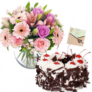 Pleasing Hamper - 12 Pink Flowers in Vase, 1/2 Kg Black Forest Cake + Card