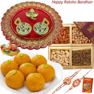 Prayes - Motichur Ladoo, Assorted Dryfruits, Designer Ganesh Thali with 2 Rakhi and Roli-Chawal