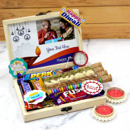 Chocolaty Diwali Box - Almond in Glass Tube, Cashew in Glass Tube, Rasin in Glass Tube, Gems in Glass Tube, Snickers, Dairy Milk Fuse, Fivestar, Perk, 4 Diwali Props, Led Light, Personalized Wooden Box with 2 Decorative Golden Diyas and Laxmi-Ganesha Coin