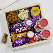 Sumptuous Diwali - Almond in Pouch, Cashew in Pouch, Dairy Milk Silk, Dairy Milk Fuse, Snicker, Dairy Milk, Five Star, Kit Kat, 3 Diwali Props, Led Light, Wooden Box with 2 Decorative Golden Diyas and Laxmi-Ganesha Coin