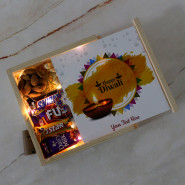 Sumptuous Diwali - Almond in Pouch, Cashew in Pouch, Dairy Milk Silk, Dairy Milk Fuse, Snicker, Dairy Milk, Five Star, Kit Kat, 3 Diwali Props, Led Light, Wooden Box with 2 Decorative Golden Diyas and Laxmi-Ganesha Coin