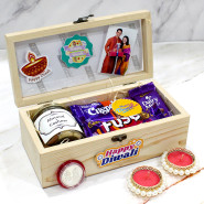 Tempting Diwali Box - Almond & Cashew in Jar, Dairy Milk Crispello, Dairy Milk Fuse, Dairy Milk, 5 Diwali Props, Led Light, Personalized Wooden Box with 2 Decorative Golden Diyas and Laxmi-Ganesha Coin