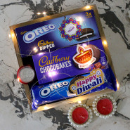 Delicious Diwali Tray - Oreo Cadbury Dipped, Cadbury Chocobakes Cookies, Oreo, 3 Diwali Props, Led Light, Wooden Tray with 2 Decorative Golden Diyas and Laxmi-Ganesha Coin