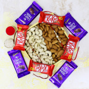 Sweet Punch - Almond & Cashew in Wooden Tray, 4 Dairy Milk, 3 Kit Kat with 2 Rakhi and Roli-Chawal