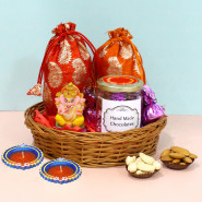 Joy of Enchanting - Almond in Potli (D), Cashews in Potli (D), Ganesh Idol, Hand Made Chocolate in Jar with 2 Diyas and Basket