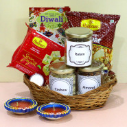 Diwali Delights - Almond in Jar, Cashew in Jar, Raisins in Jar, Soan Papdi, Haldiram Namkeen with 2 Diyas, Laxmi-Ganesha Coin and Premium Basket