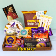 Fun Filled Combo - Cornitos Chips, Sapphire Cookies, Almond in Personalized Jar, Dark Fantasy Choco Nut Fills, 2 Dairy Milk, Fruit n Nut, Fuse, Crispello, Kitkat, Nutties, Kinder Joy, 3 Rakhi Props, Personalized Wooden Tray with 2 Rakhi and Roli-Chawal