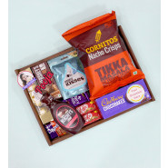 Hearty Whishes - Hershey's Milk Shake Chocolate Flavour, Hershey's Syrup, Ferreo Rocher 4 Pcs, Hershey's Kisses Cookies & Cream, Cadbury Chocobakes, Crispello, Dairy Milk, 2 Kit Kat, Cornitos Chips, 2 Personalized Props, Wooden Tray and Card
