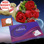 Roses N Chocolates - 12 Red Roses + Cadbury's Celebration 128 gms+ Card