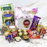 Diwali Chocolate & Dry Fruits Gifts Box - Almonds in Personalized Tin, Cashews in Personalized Tin, Ferrero Rocher 4 pcs, Dairy Milk Silk, Fuse, 2 Kit Kat, Five Star, 2 Diwali Props, Pink Flower Gift Box with 2 Elephant Diyas and Laxmi-Ganesha Coin