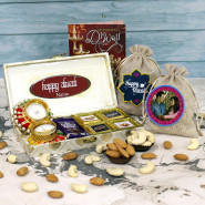 Diwali Blessing Hamper - Almonds in Potli, Cashews in Potli, 4 Hand Made Chocolates with Diwali Stickers, 2 Dairy Milk, 3 Diwali Props, Charming Cream & Golden Gift Box with 2 Decorative Diya and Laxmi-Ganesha Coin
