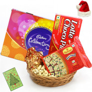 Christmas Festivity - Cashewnuts in Potli, Cadbury Celebrations, Soan Papdi, Chocopie, Basket with Santa Cap and Greeting Card