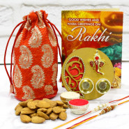 Almond with Floral Thali - Almond in Potli (D), Artistic Ganesha Thali with Golden Base with 2 Rakhi and Roli-Chawal