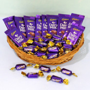 Cadbury Hamper - 10 Dairy Milk, Cadbury Choclairs 25 Pcs in Basket and Card