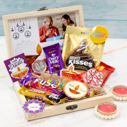 Ideal Diwali Gift Box - Almond in Glass Tube, Gems in Glass Tube, Hershey's Kisses Milk Chocolates, Dairy Milk Fuse, Dairy Milk, Fivestar, 2 Kit Kat, 5 Diwali Props, Led Light, Personalized Wooden Box with 2 Decorative Golden Diyas and Laxmi-Ganesha Coin