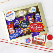 Chocolate Symphony Personalized Rakhi Hamper - Ferreo Rocher 4 Pcs, Dairy Milk Fruit & Nut, Snickers, Fuse, Crispello, Kitkat, 5 Rakhi Props, Elegant Golden Gift Box with Sleeve with 2 Rakhi & Tika