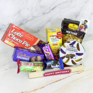 Perfect Presents - Sapphire Choco Chip Cookies, Dairy Milk Silk, Cadbury Chocobakes, Britania Cake, Nutri Choice Biscuits, Haldiram Namkeen, Oreo Biscuits, Lotte Choco Pie, 3 Personalized Props, Wooden Tray and Card 