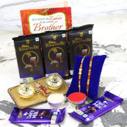 Bournville with Thali - 3 Bournville2 2 Dairy Milk, Alluring Golden Base Ganesha Thali with Diamond Border with 2 Rakhi and Roli-Chawal