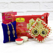 Auspicious Pair Thali - Auspicious Ganesha Thali with Pearls, Soan Papdi with Bhaiya Bhabhi Rakhi Pair and Roli-Chawal