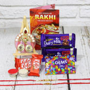 Impressive Combo - Designer Ganesha Thali with Pearls & Diamond, 2 Dariy Milk Fruit & Nut, 3 Kitkat , 1 Gems with 2 Fancy Rakhis and Roli-Chawal