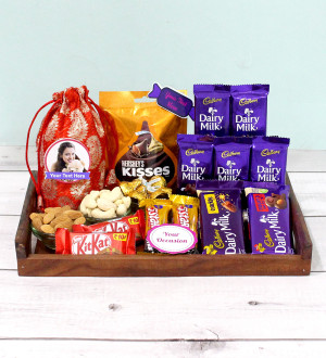 Gladness in Tray - Almond & Cashew in Potli (D), Hersheys Kisses Almond, Dairy Milk Fruit n Nut, Dairy Milk Crackle, 5 Dairy Milk, 2 Five Star, 2 Kit Kat, 3 Personalized Props, Wooden Tray