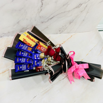 Tempting Choco Hamper - 3 Red Roses, 2 Dairy Milk Roast Almond, 2 Toblerone, 5 Cadbury Dairy Milk, 4 Kit Kat, Ferrero Rocher 3 pcs Bouquet