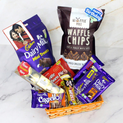 Sweet Surprise Basket - Ferreo Rocher 4 Pcs, Waffle Chips, Dairy Milk Mini Treat, Dairy Milk Crackle, Dairy Milk Roast Almond, Dairy Milk Fruit & Nut, Crispello, Five Star, Chocopie, 3 Personalized Props, Stick Basket