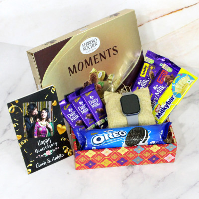 Attractive Gift Hamper - Ferrero Rocher Moments, Smart Watch, 3 Dairy Milk, Dairy Milk Fruit N Nut, Dairy Milk Crackle, Milkybar, Oreo Biscuit, Designer Gift Tray and Personalized Card